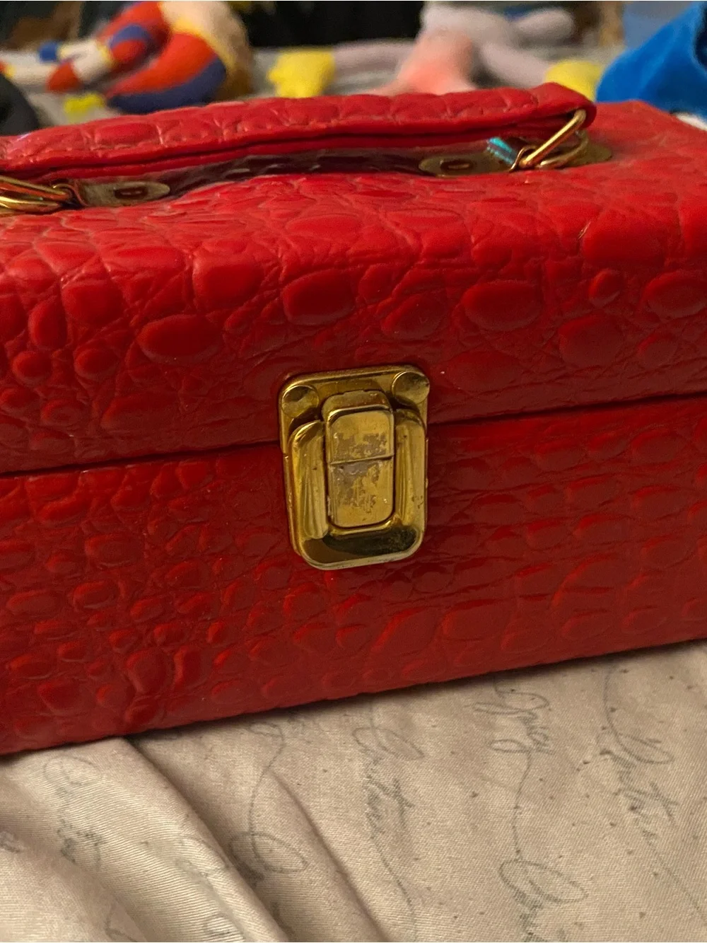 Red Textured Cosmetic Jewelry Case with Gold-Tone Clasp